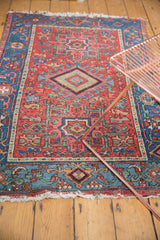 Antique Karaja rug's lower edge, showing sky blue border and hard tattered ivory fringe.