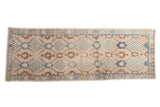 Vintage distressed Oushak runner with pale blush, faded blue, bronze allover lattice floral design. 3'5
