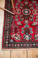 Secure ivory fringe and a patterned floral border of the vintage Hamadan rug.
