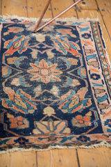Tattered fringe and lower border of a hand knotted antique Persian Lilihan rug.
