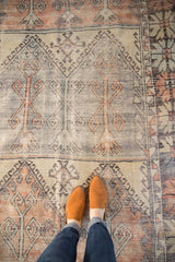 Distressed Oushak runner detail, showing worn pile, geometric motifs in pale blush, slate blue.