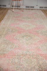 Worn texture and subtle pink, ivory, and bronze colors of the vintage Sparta rug.