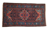 Vintage Persian Dargezine rug, central quatrefoil medallion, navy, blush, and aqua Herati design.
