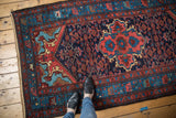 Detailed quatrefoil medallion and allover herati motif in navy, blush, and aqua.