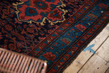 Hand knotted vintage Dargezine rug with rich aqua and red curvilinear border motifs.