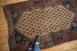 Antique Kurdish Hamadan rug corner, camel lattice and navy spandrel with ivory outline.