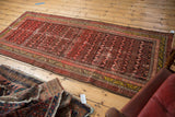 Antique Malayer runner rug, circa 1920s, vivid red, saffron, charcoal serrated leaf patterns, authentic wear.