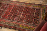 Antique Malayer rug runner with allover serrated leaf pattern, geometric borders, and aged patina.