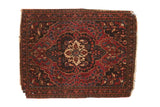 Antique Farahan Sarouk rug with scalloped medallion, floral field, cherry red, navy, ivory hues.