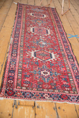 Vintage Karaja runner with repeating Heriz-style medallions in cherry red, navy, and ivory.
