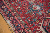 Tattered side and worn pile of a Karaja runner, with red and blue geometric motifs.