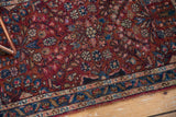 Hand-knotted vintage Persian Lilihan rug corner, showing floral border in burgundy, sky blue, ivory.