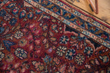 Floral bouquet motif and worn pile of Lilihan rug in raspberry red and sky blue.