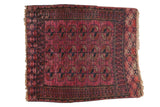 Antique Turkmen hand-knotted square rug, circa 1910s, low pile, fuchsia and navy 'elephant footprint' guls.