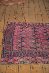 Antique Turkmen rug showing low pile fuchsia and navy 