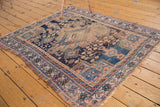 Geometric border of antique Afshar rug, showing pale apricot, sky blue, and tattered fringe.