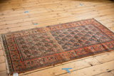 Vintage Doroksh rug with dynamic allover paisley boteh motif and tangerine border.