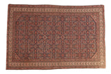 Antique Persian Malayer rug with a dense allover herati motif in navy, red, and sky blue.