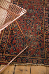 Visible tattered fringe and low pile on the vintage Lilihan rug, revealing knot heads.