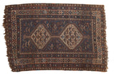 Vintage Qashqai rug with interconnected double medallions, navy field, tribal birds and animals.