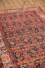 Vintage Malayer rug detail: low pile, dark navy Herati motifs, brick red Serbend border.