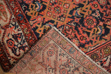 Vintage Malayer rug corner displaying hand-knotted foundation and Herati design.