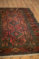 Antique Persian Lilihan rug: samovar motifs, pinwheels, dusty raspberry field, and light fringe.