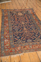 Tattered fringe and detailed madder red borders with sky blue accents, antique Hamadan rug.