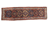 Antique Northwest Persian rug runner, dark navy field, geometric lattice, madder red, ivory, and gold.