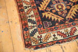 Detail of antique Northwest Persian runner's geometric borders, serrated leaf pattern, light fringe.
