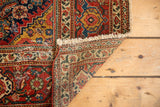 Antique Fereghan rug corner, showing detailed herati pattern, fringe, and hand knotted reverse.