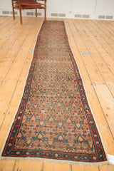 Antique Serab runner corner with natural camel, aubergine, and blue staggered lattice motif.