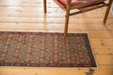 Antique Serab runner with lattice motif and natural camel, blue, and madder red paneled design.