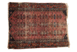Antique Lilihan fragment rug, faded raspberry, germinating plant and fish motifs, blue and copper.
