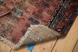 Tattered cream fringe and intricately hand-knotted foundation of the antique Lilihan rug.