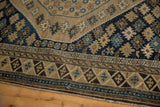 Antique Shirvan rug with worn original selvage and primitive starburst patterns.