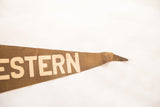 Vintage Northwestern felt pennant's tapered end, showing block lettering on time-worn brown felt.
