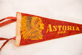 Astoria Oregon felt pennant close-up showing red ties, cream binding, and chief graphic corner.