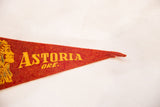 Close-up of the vintage red felt pennant's pointed tip with slight loss.