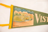 Vintage Vista House felt pennant displaying graphic and yellow stitched edge.