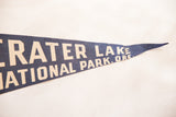 Navy blue vintage Crater Lake felt pennant, cream text, pointed end with stretched pinholes.