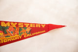 Vintage Trees of Mystery felt pennant, showing tapered red felt and yellow California text.