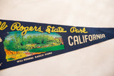 Detail of vintage felt pennant showing 'State Park' and 'CALIFORNIA' text with ranch home.