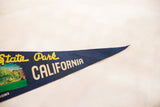 Pointed end of the dark blue felt pennant, showing 'CALIFORNIA' text.