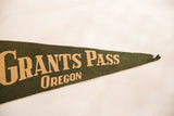Pointed tip of the vintage dark green felt pennant, showing 