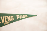 Green felt pennant's pointed end, featuring cream 