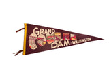 Vintage Grand Coulee Dam felt pennant in brown with a yellow border and scenic lettering.