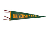 Vintage University of B.C. felt pennant, green with gold block letters and red ties.