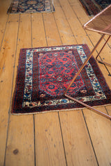 Vintage Persian Engelas mat with repeating Herati design in cherry red and navy blue.
