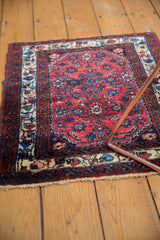 A vintage Engelas square rug highlighting the soft texture of its red and blue wool pile.
